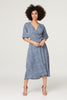 Navy | Printed Tie Waist Wrap Midi Dress : Model is 5'9