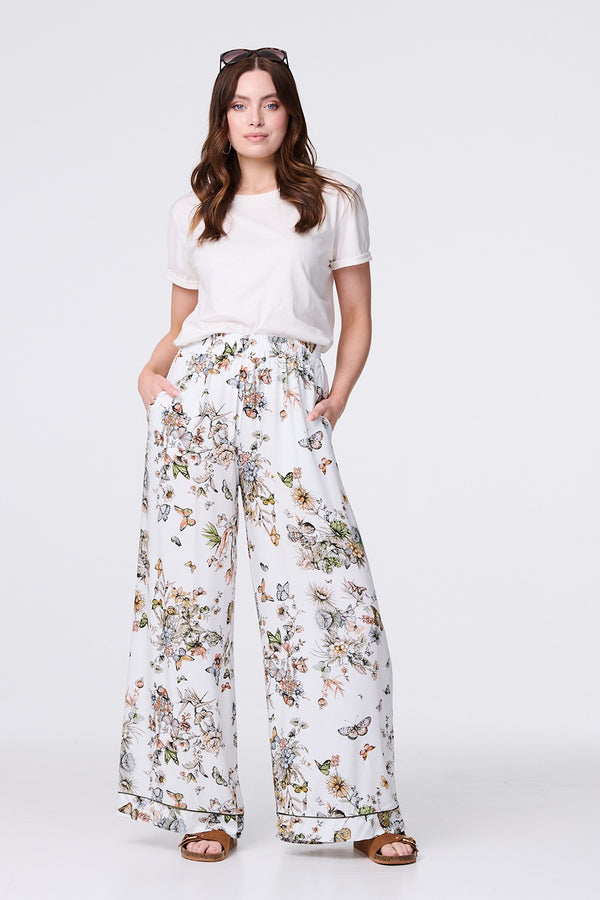 Beige | Butterfly Print High Rise Relaxed Trousers : Model is 5'9"/175 cm and wears UK8/EU36/US4/AUS8