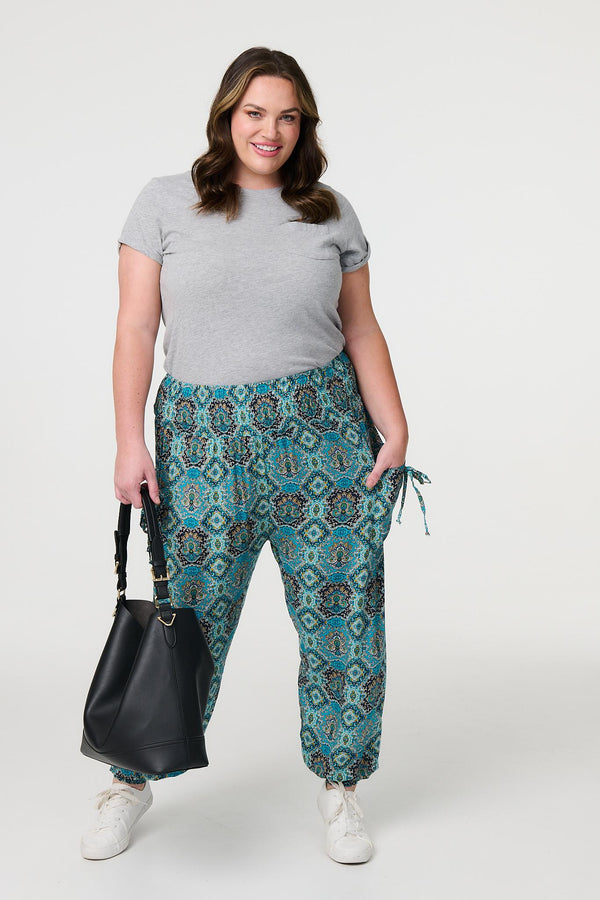 Green | Printed Pull On Tapered Pants : Model is 5'8"/172 cm and wears UK18/EU46/US14/AUS18