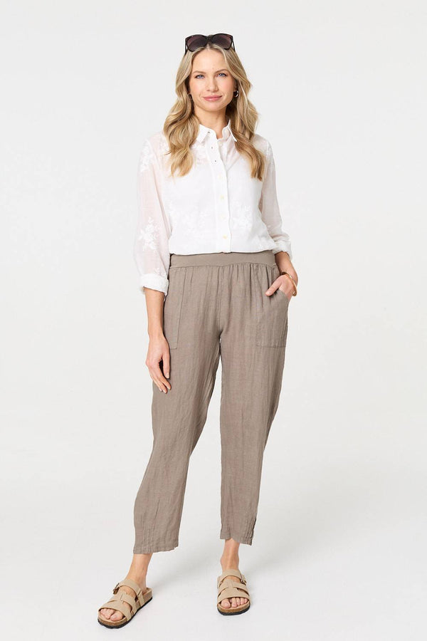 Brown | Relaxed Linen Blend Tapered Trousers : Model is 5'10"/178 cm and wears UK10/EU38/US6/AUS10