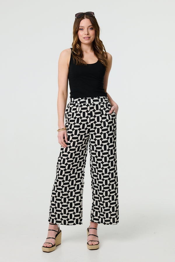 Black | Geo Print High Waist Wide Leg Trousers : Model is 5'9"/175 cm and wears UK8/EU36/US4/AUS8
